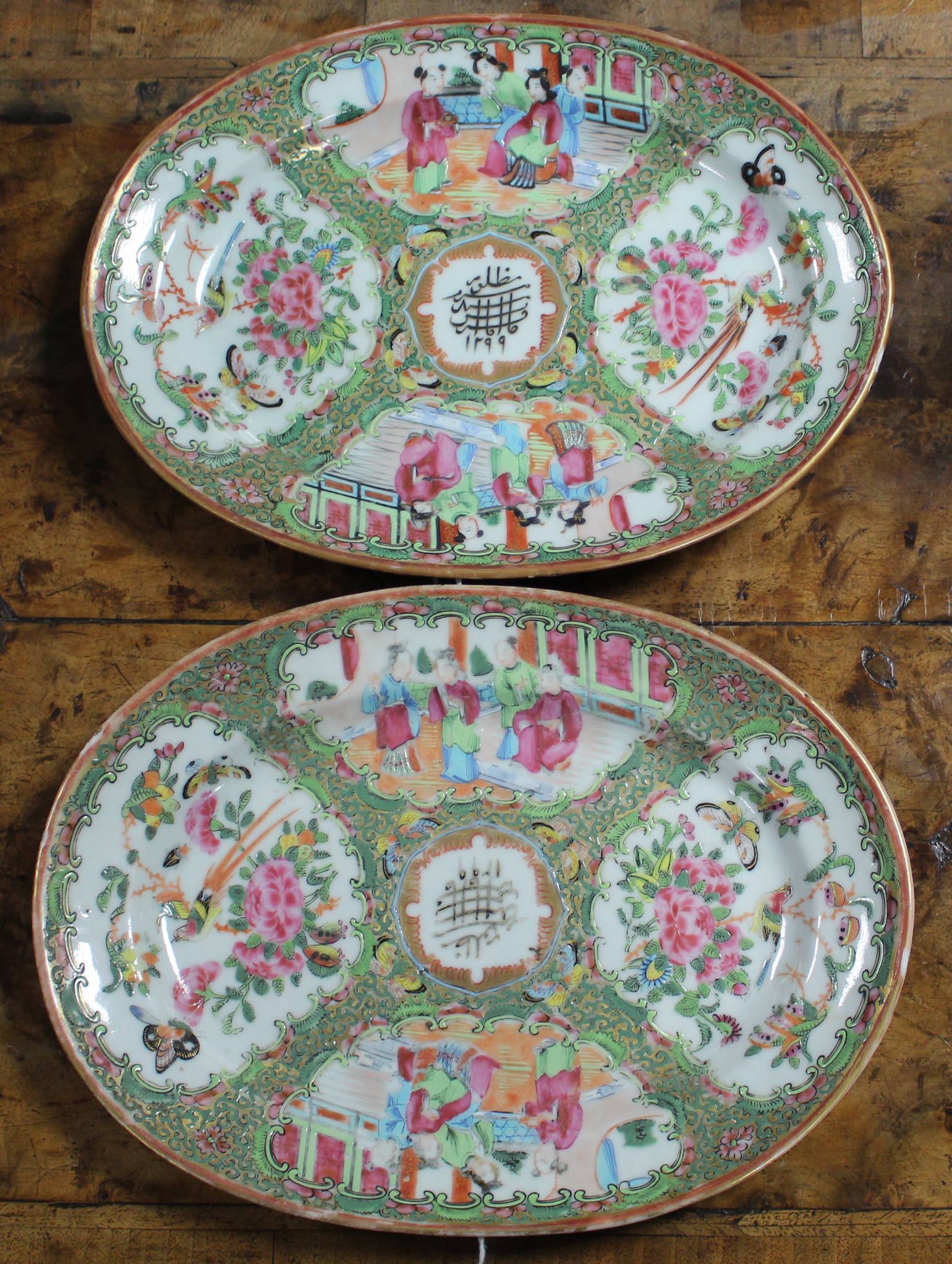 A pair of Chinese porcelain Rose Canton oval dishes for the Arabian market,