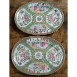 A pair of Chinese porcelain Rose Canton oval dishes for the Arabian market,