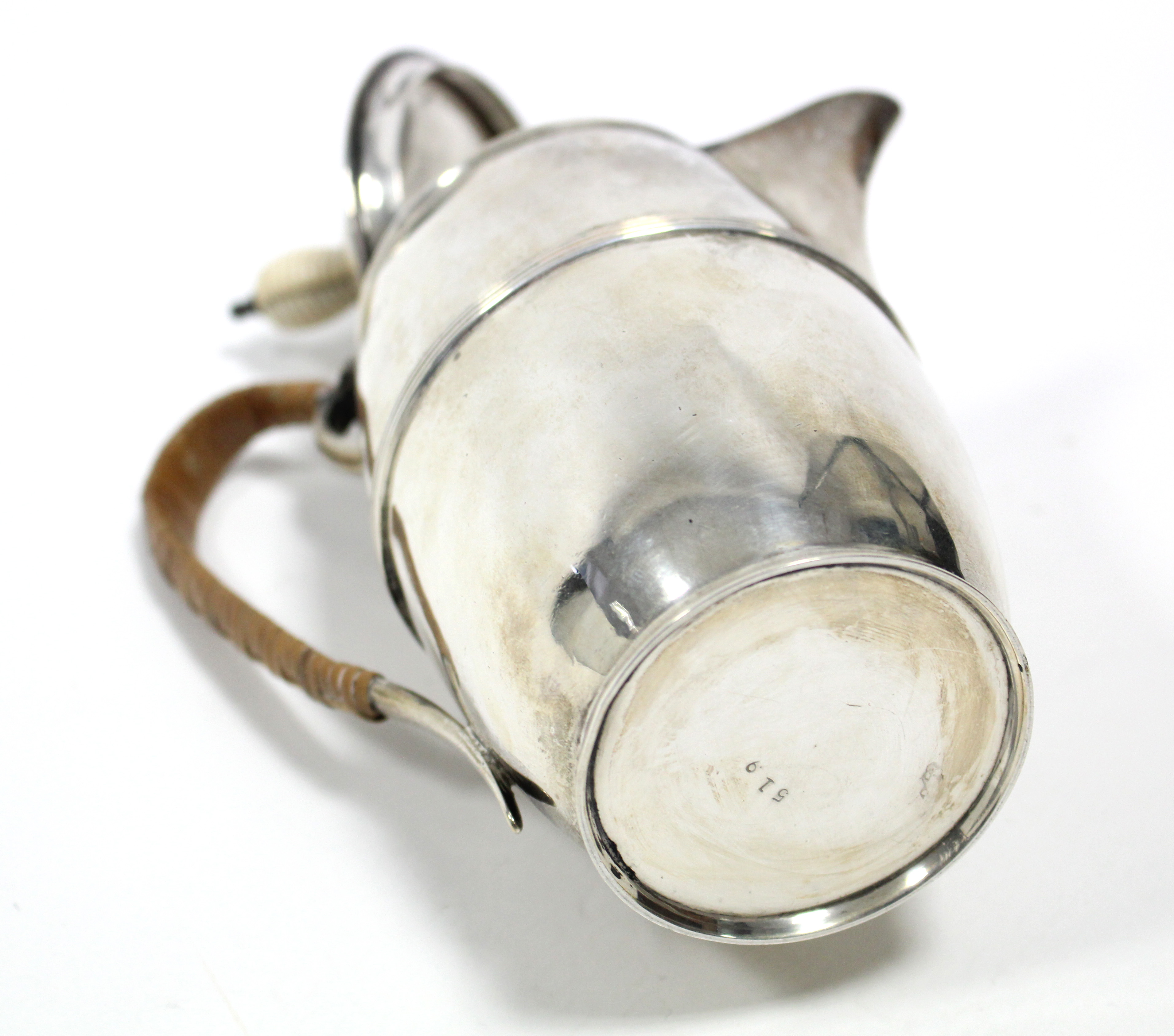 An Edwardian silver hot water jug of slender ovoid shape with reeded band around the girth, cane- - Image 4 of 4