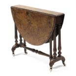 A mid-Victorian burr-walnut Sutherland table with oval drop leaves supported by turned tapering