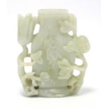 A Chinese carved & pierced jade vase of pale celadon colour with white striations, the flat-sided