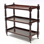 A Victorian three-tier dumb waiter on turned & reeded tapering supports with brass castors; 41½”