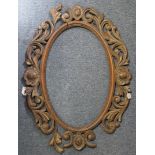 A 19th century carved wood oval picture frame in sections; 32­½” x 24”; 32½” x 24” overall (w.a.f.)