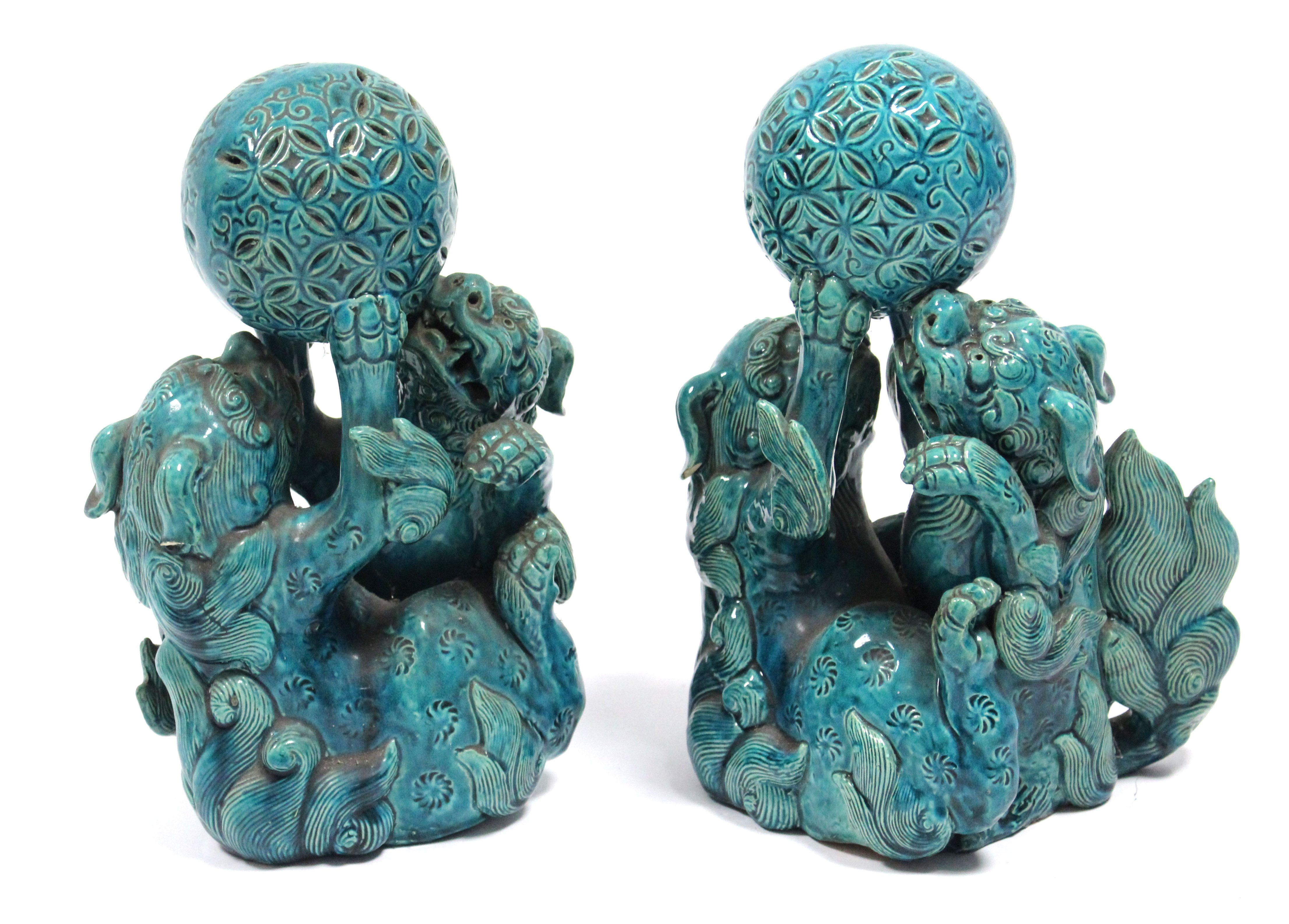 A pair of 19th century Chinese turquoise-glazed groups, each of two Kylin fighting over a brocaded - Image 2 of 9