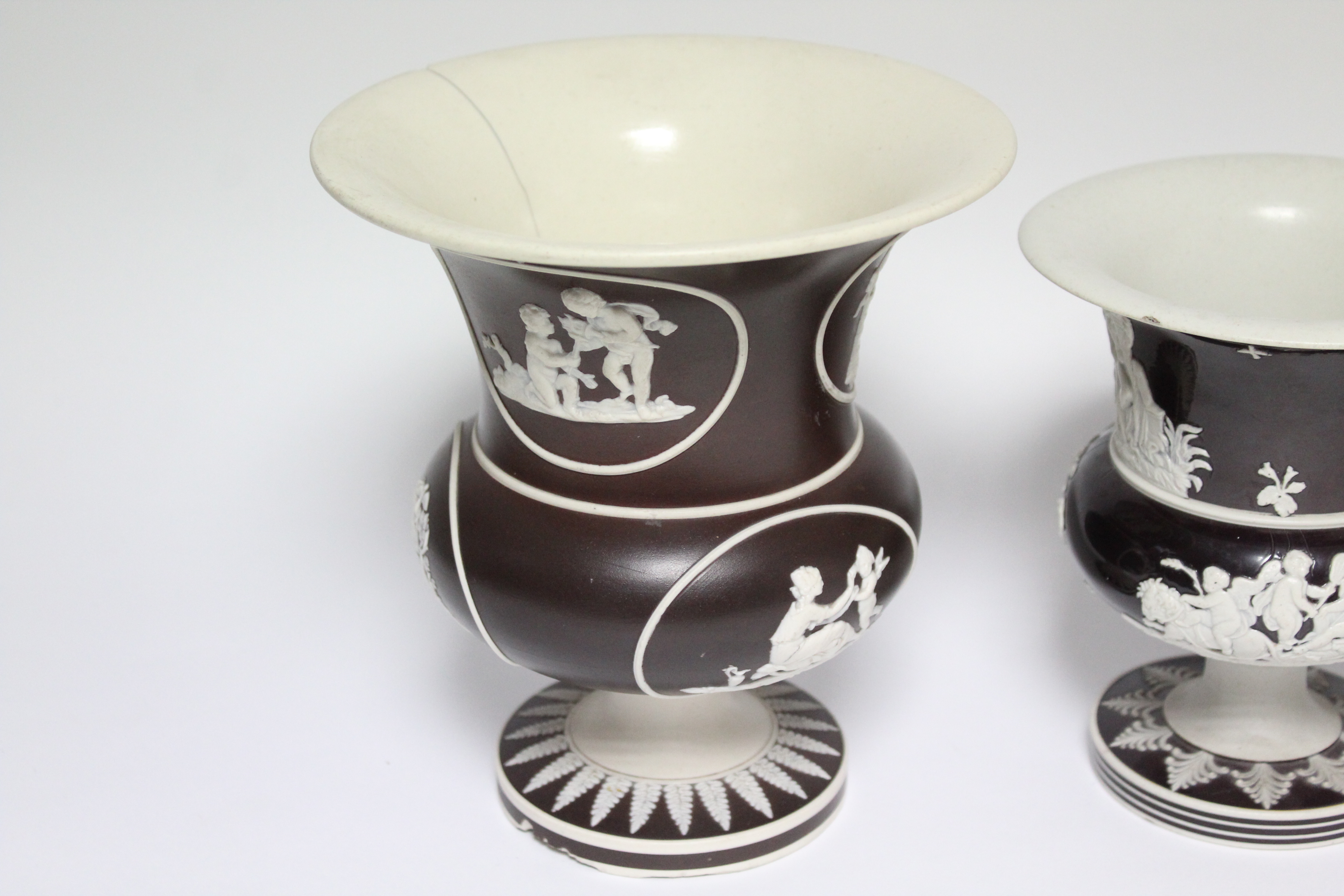 A pair of campana-shaped vases of chocolate-brown ground with applied white decoration of - Image 2 of 3