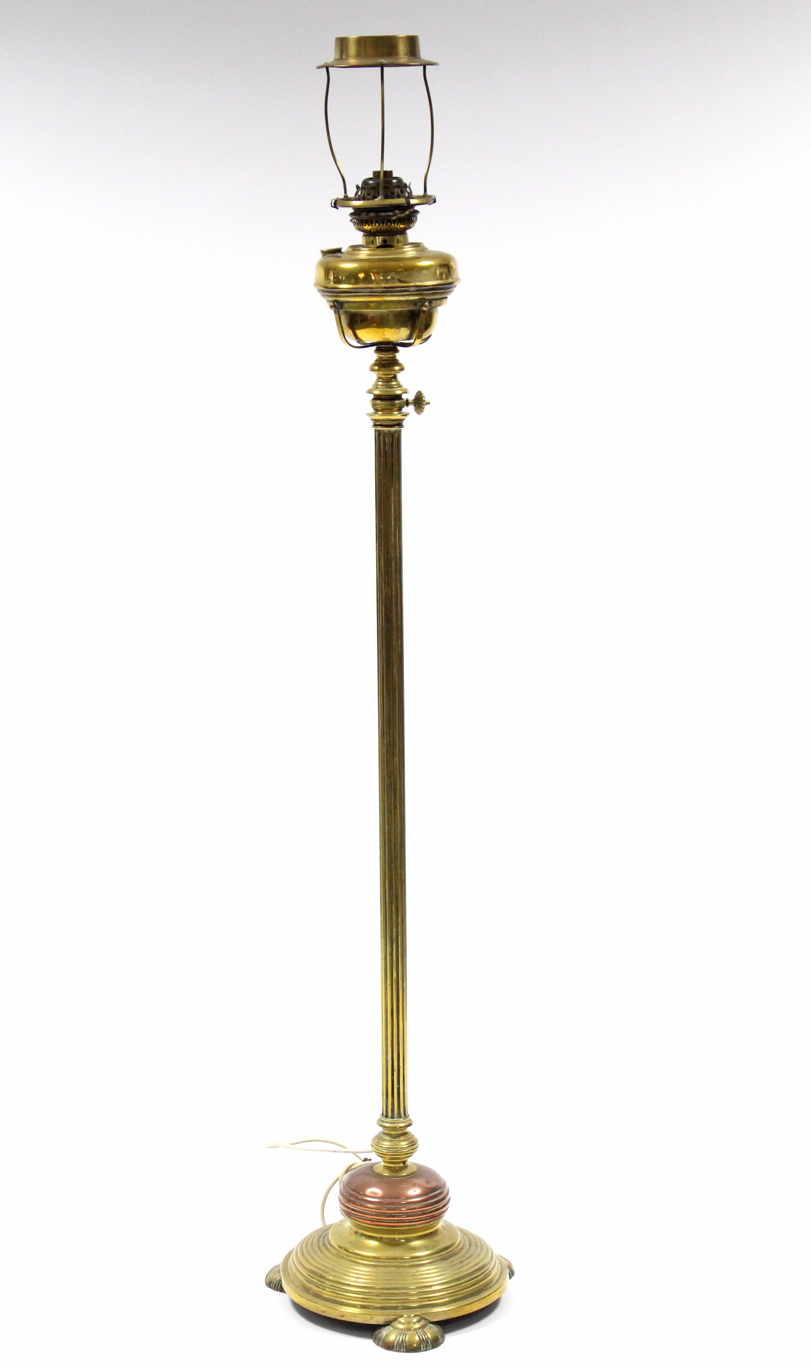 A Victorian brass & copper standard lamp on reeded column & circular base; 60” high.