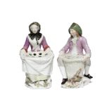 A PAIR OF CHELSEA PORCELAIN MALE & FEMALE BOUQUETIERE FIGURES, each seated on a rocky base, he