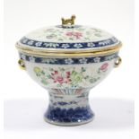 A late 19th/early 20th century Chinese porcelain covered bowl of squat round form, with floral