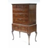 AN EARLY 18th century WALNUT CHEST-ON-STAND, with moulded cornice, fitted three short & three long