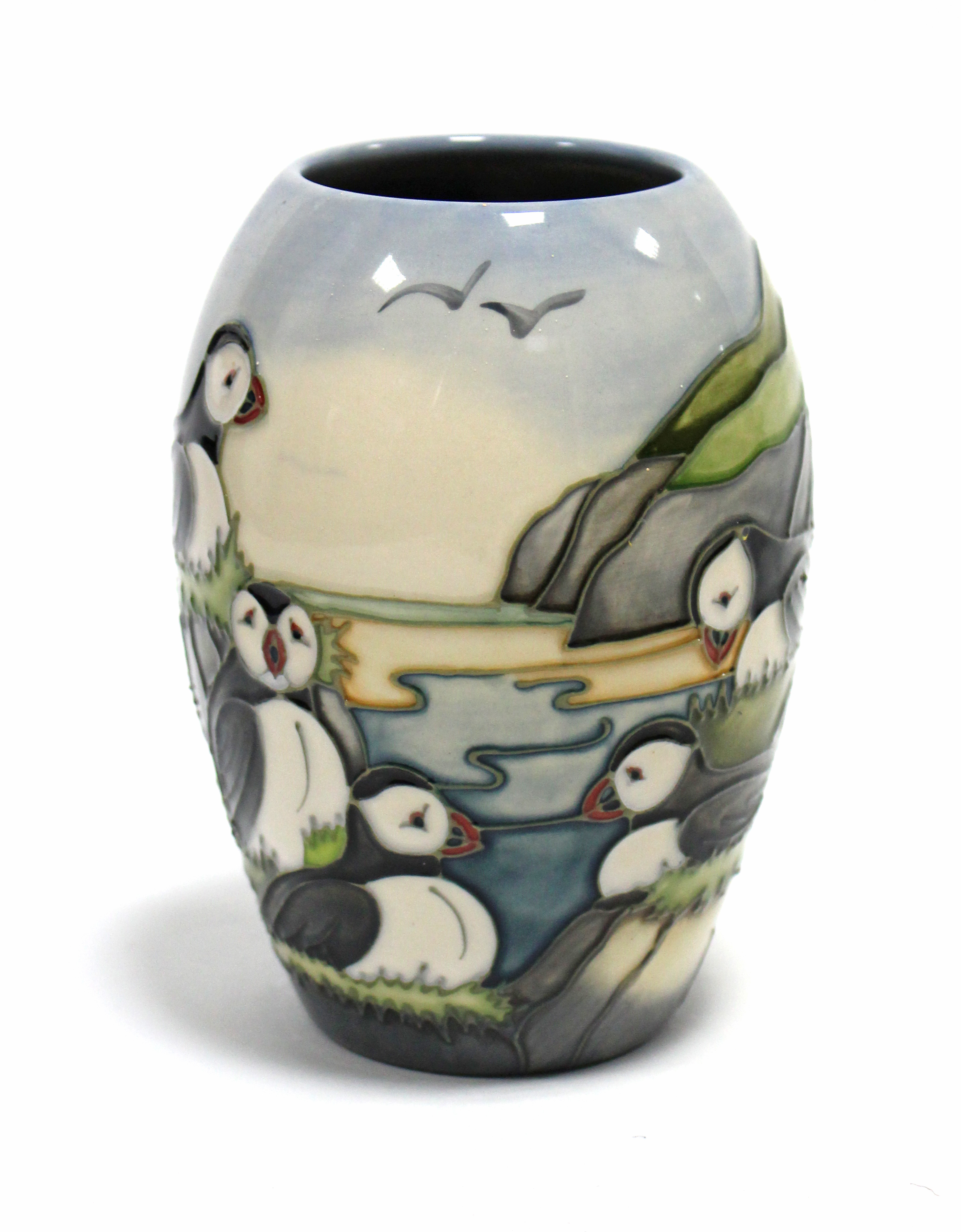 A Moorcroft pottery “Puffins” vase of ovoid form, decorated with Puffins on a cliff-top, dated 97 to