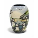 A Moorcroft pottery “Puffins” vase of ovoid form, decorated with Puffins on a cliff-top, dated 97 to