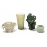 A Chinese pale green jade archer’s ring, 1½” diam.; a ditto beaker-shaped vessel, 3¼”; a spinach