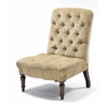 A Victorian nursing chair, the buttoned seat & back upholstered cream velour, on turned tapering