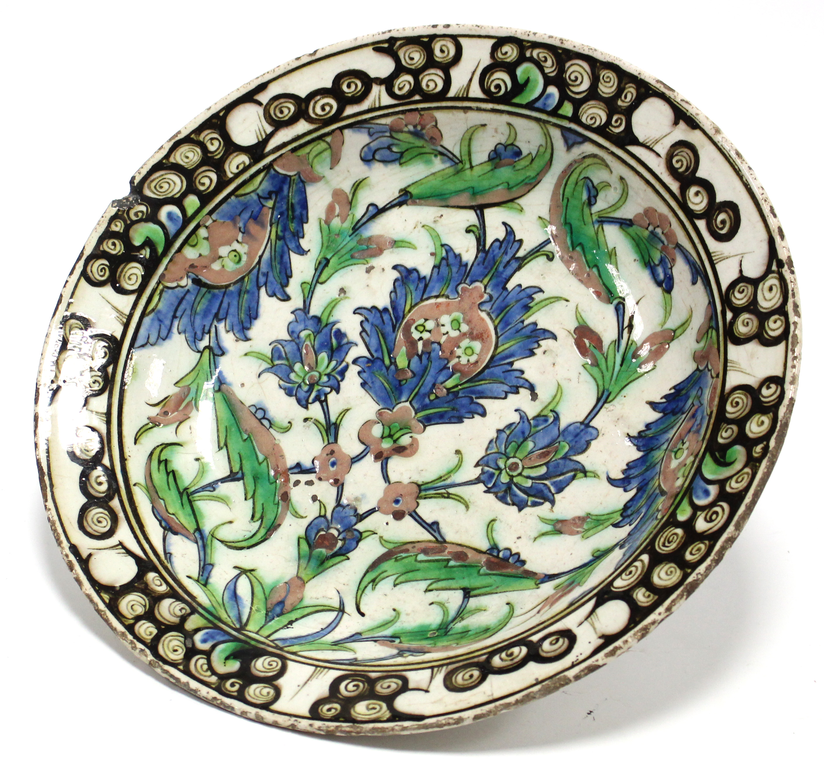 A 17th century IZNIK POTTERY SHALLOW DISH with polychrome painted stylised floral decoration - Image 4 of 6