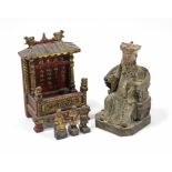 A Chinese carved wood & polychrome decorated seated figure of an emperor, 11” high (the painted