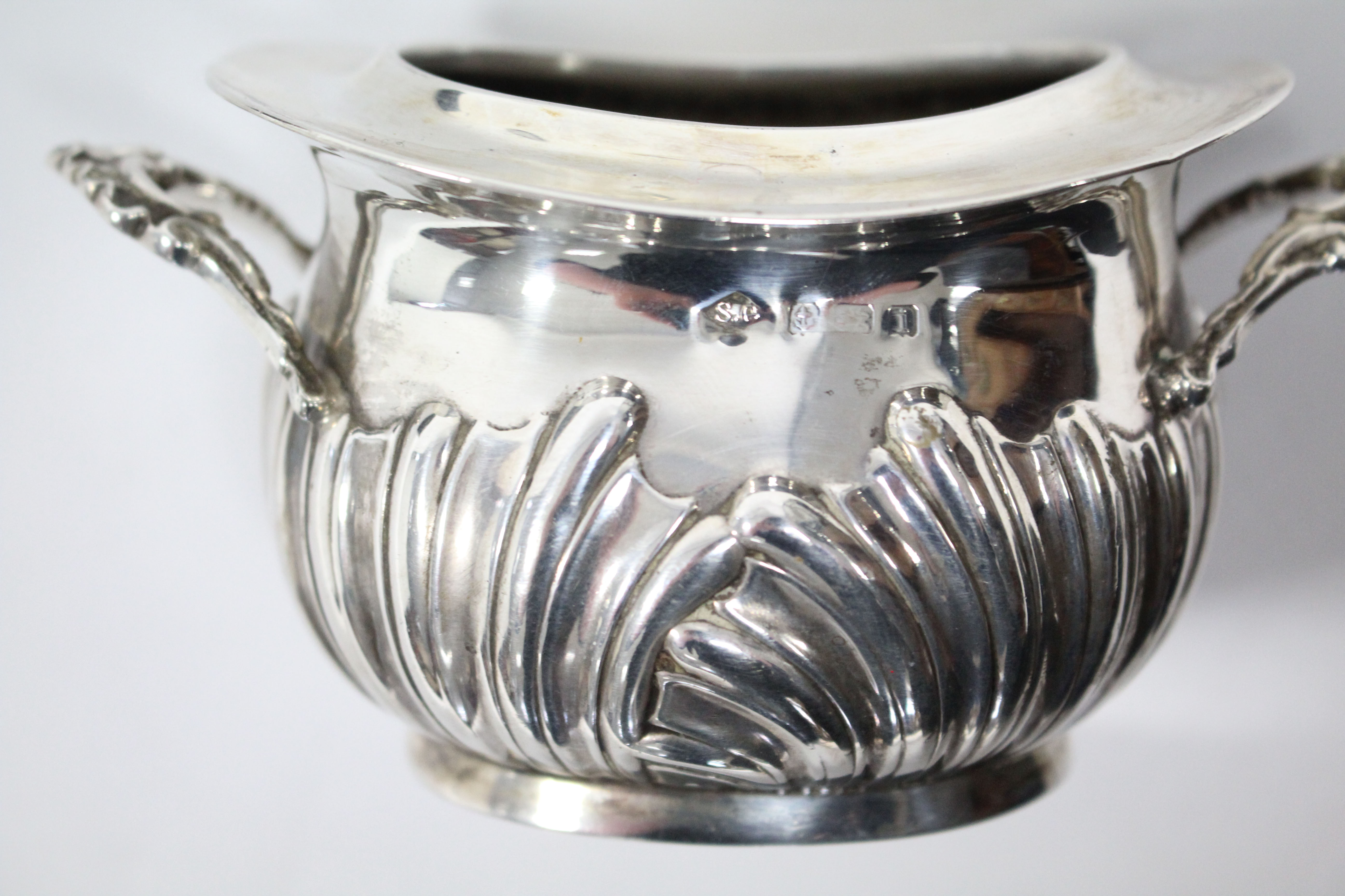 An Edwardian silver two-handled tea caddy of oval semi-fluted form, with removable lid, 4½” wide, - Image 4 of 4