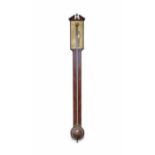 A George III stick barometer, the engraved brass calibrated plate signed: “Gilbert & Wright,