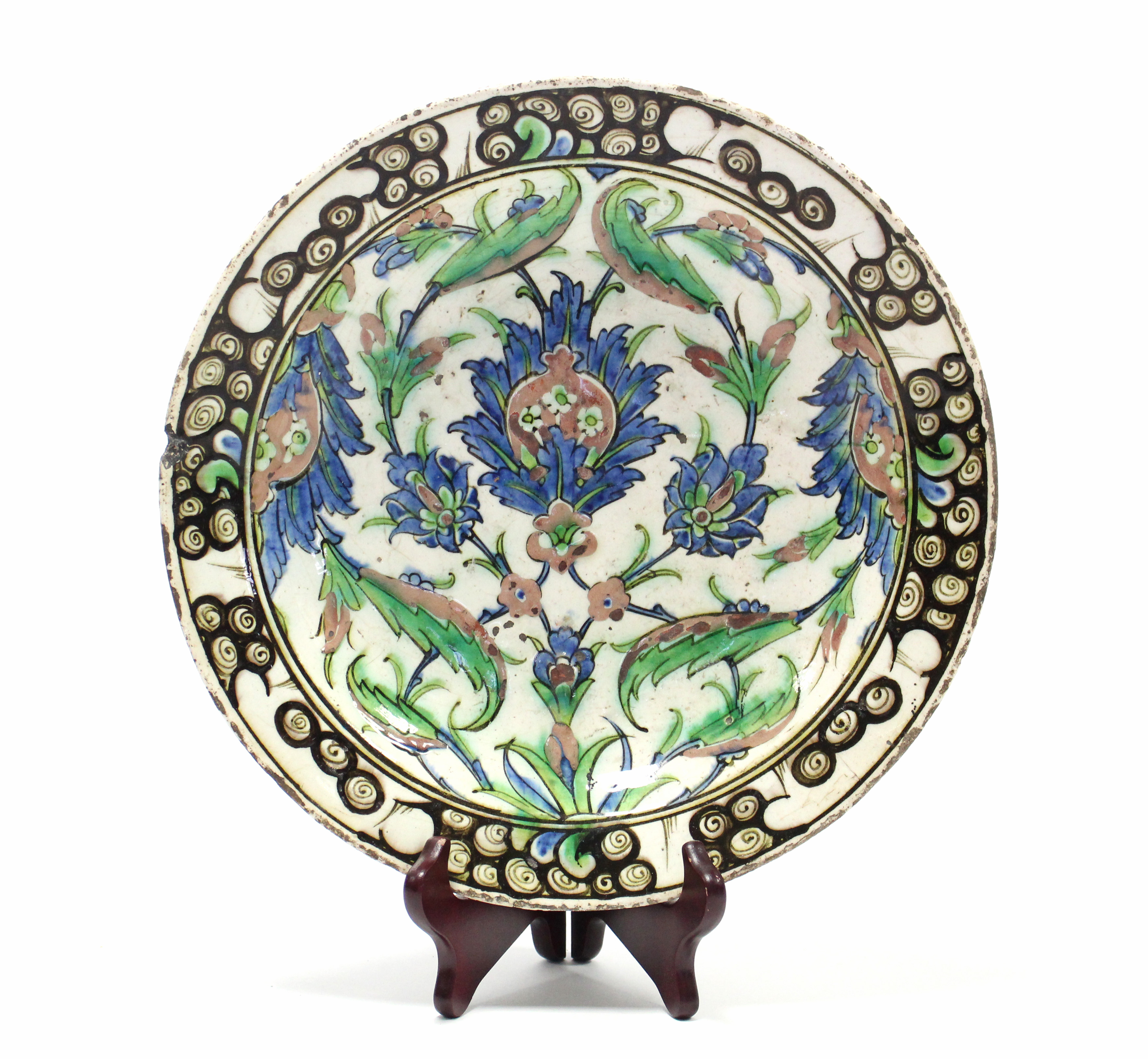 A 17th century IZNIK POTTERY SHALLOW DISH with polychrome painted stylised floral decoration - Image 2 of 6