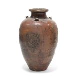 A South-East Asian brown glazed earthenware tall ovoid vase, with short narrow neck & lug handles to