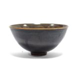A finely potted Chinese small deep bowl with teadust-glazed interior, the exterior with rich brown