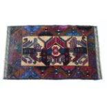 A Baluchi rug of cream & rust ground with central lozenge & hook motif within geometric border; 4’