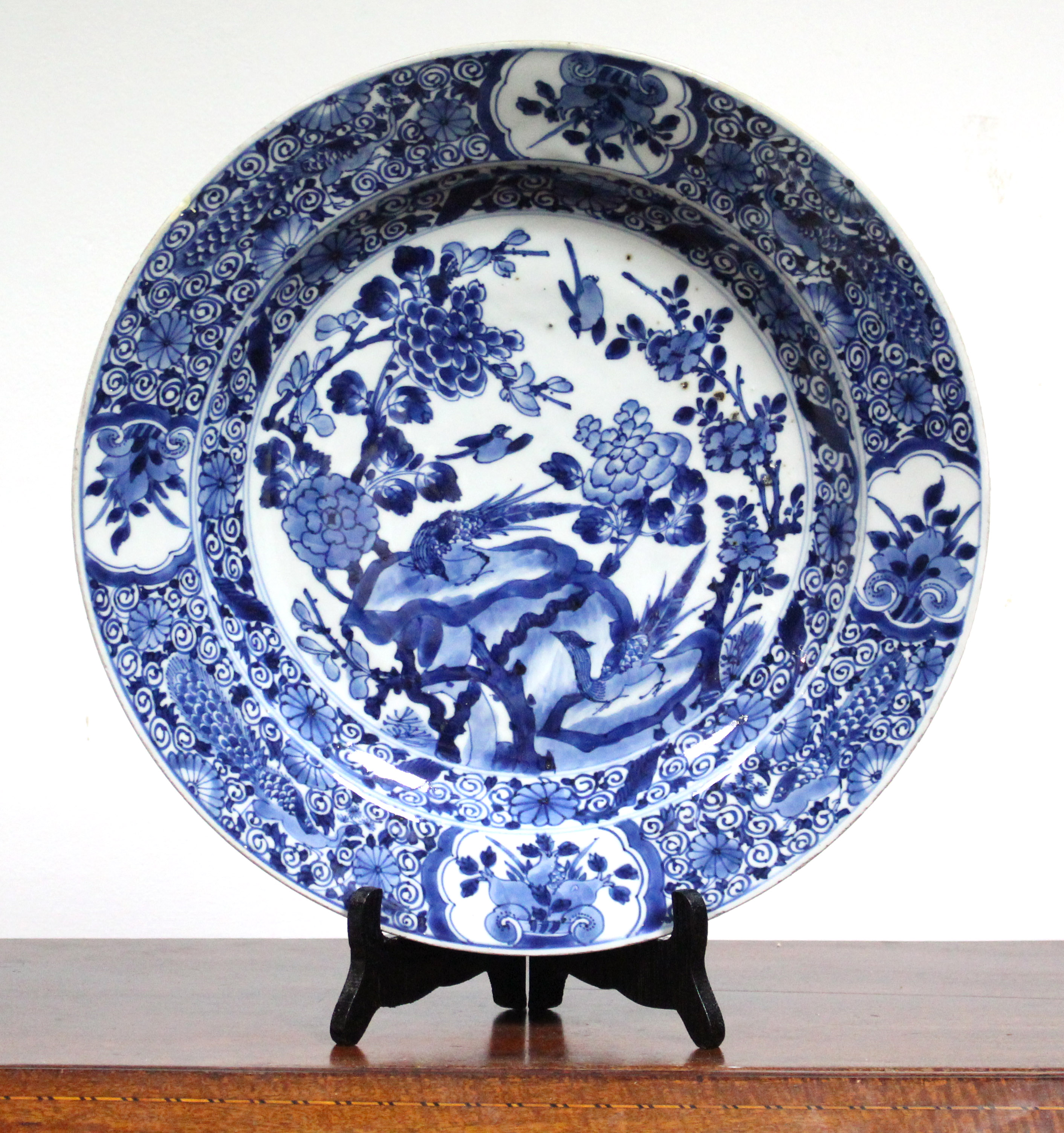 An 18th century Chinese blue & white porcelain large shallow dish painted with pheasants & songbirds