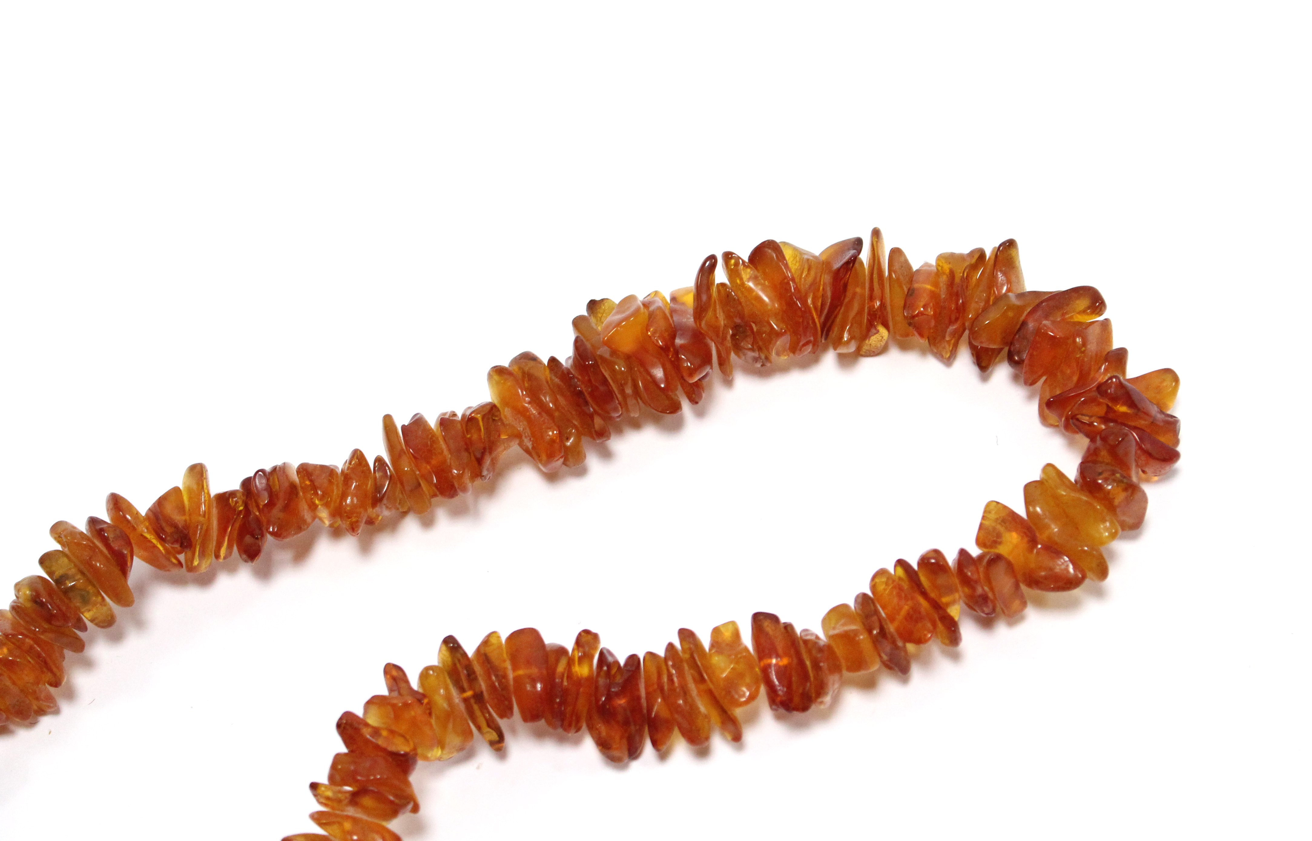 A Baltic amber necklace of graduated irregular-shaped segments; approx. 27” long. - Image 2 of 2