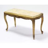 A late 19th century French gold painted low occasional table, with shaped rectangular simulated