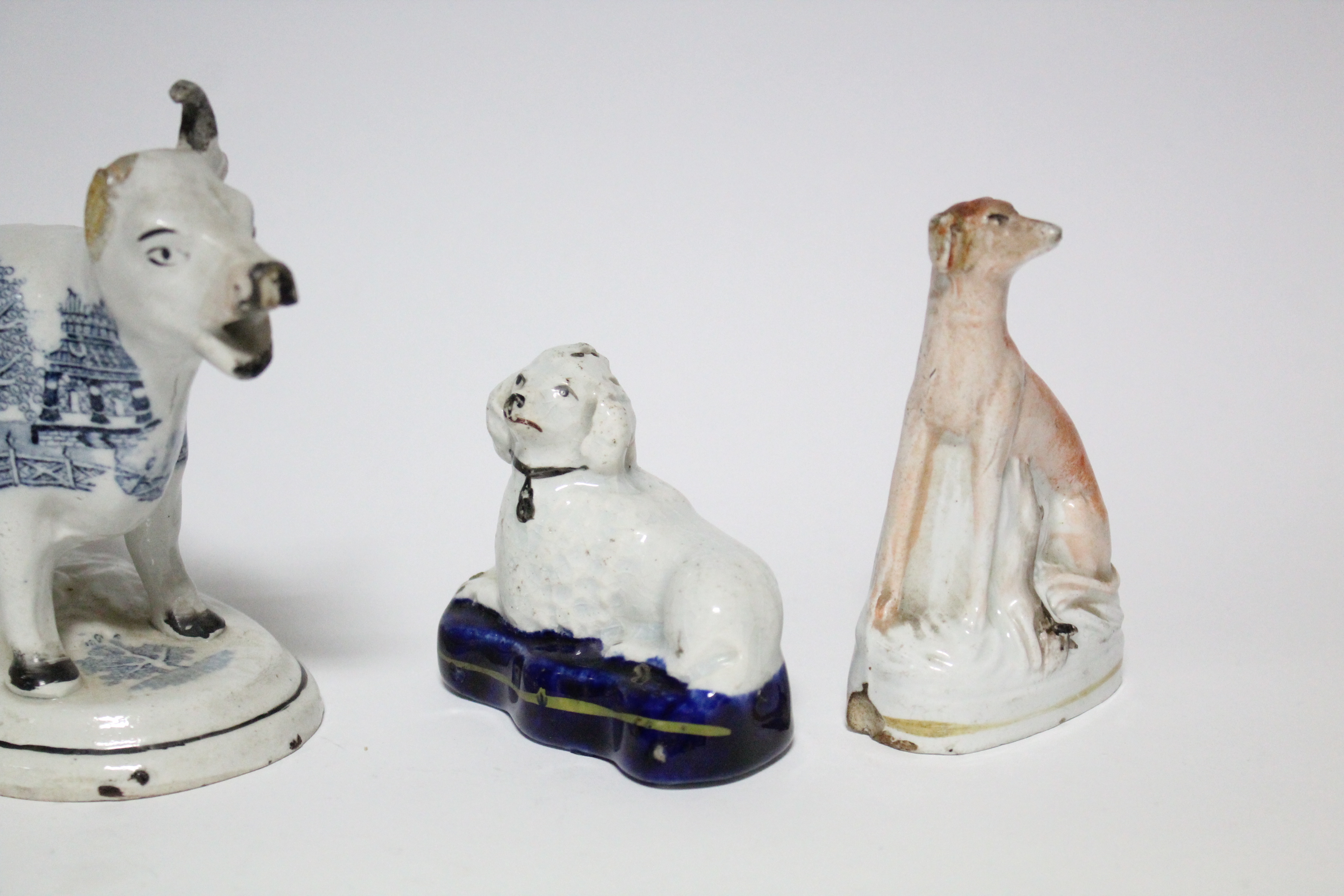 Three small Victorian Staffordshire pottery models of seated dogs, the largest 4” high; a ditto - Image 5 of 5