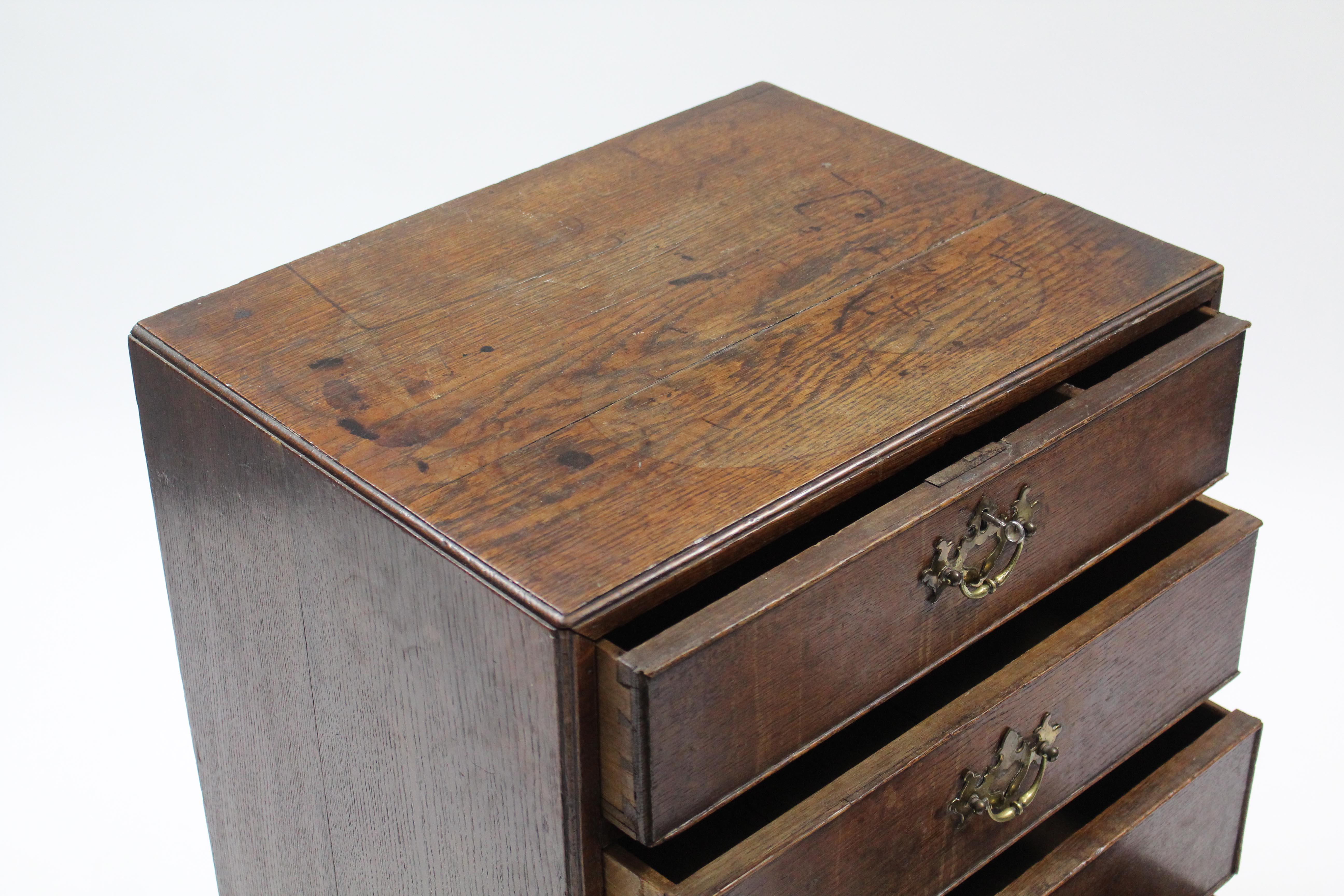 An 18th century style narrow oak chest fitted three drawers with brass swing handles above a - Image 3 of 3