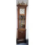 A mid-20th century grandfather clock with silvered dial, & in oak case enclosed by glazed door,