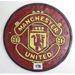 A modern painted cast-iron plaque “Manchester United”, 9¾” diam.