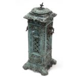 A turquoise enamelled cast-iron stove, 28½” high.