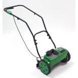 A G-tech “CM01” cordless cylinder mower, lacking grass box.