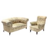 A Victorian chesterfield-style sofa & matching armchair, each upholstered printed material with