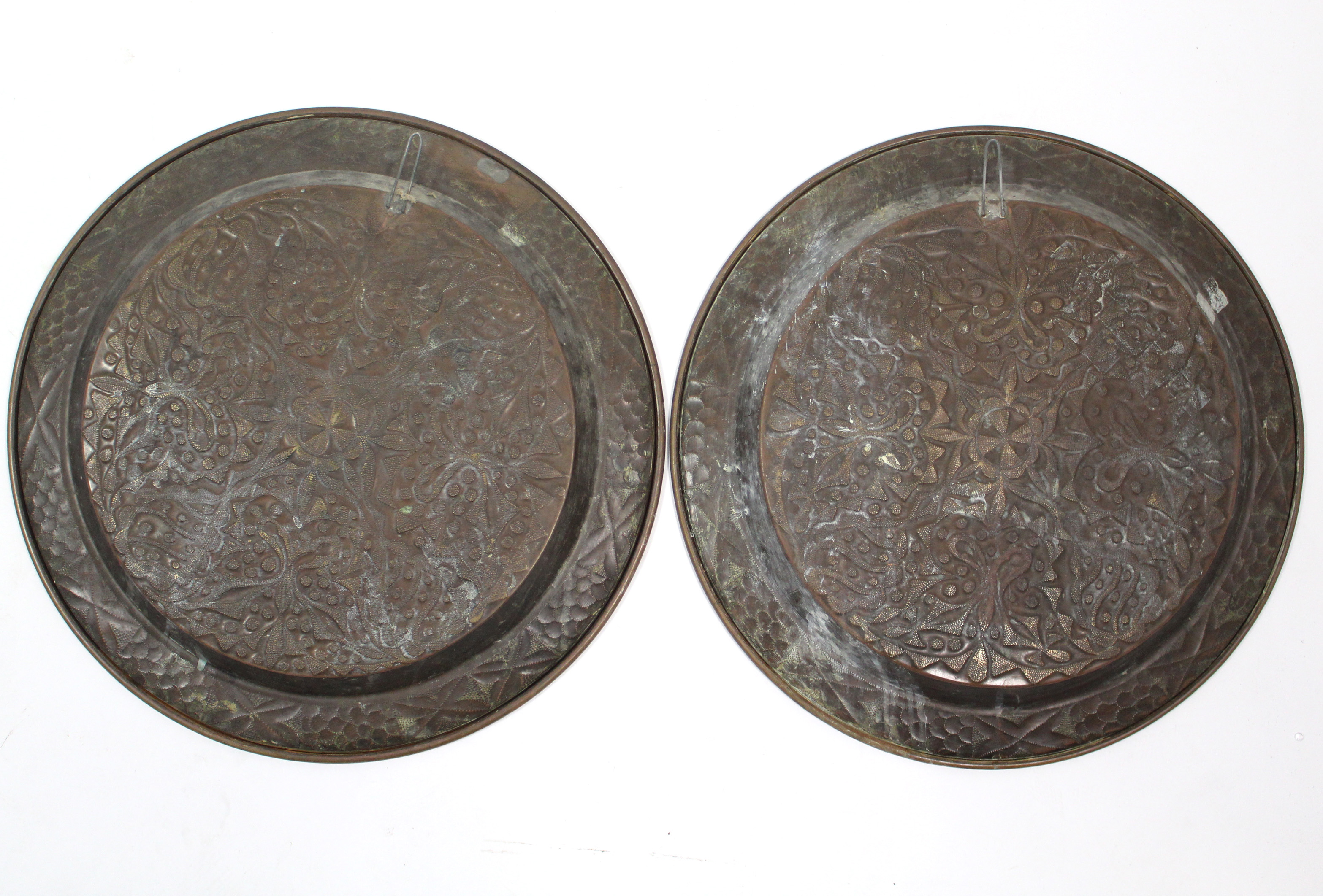 A pair of brass wriggle-work large circular dishes with all-over raised geometric design, 17¾” - Image 2 of 2