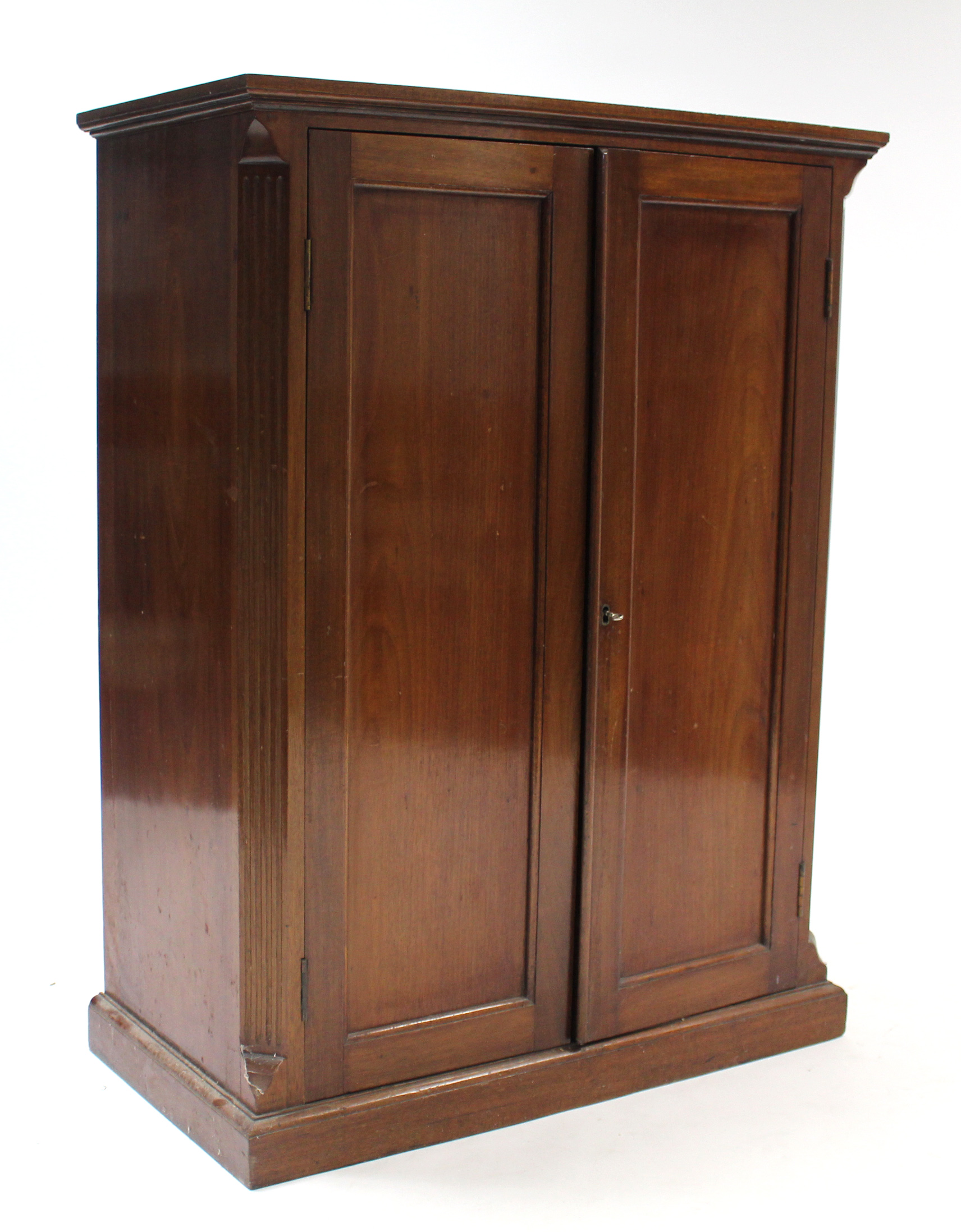 An Edwardian mahogany small upright cabinet fitted three shelves enclosed by pair of panel