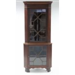 A 19th century inlaid-mahogany standing corner display cabinet, fitted three shaped shelves enclosed