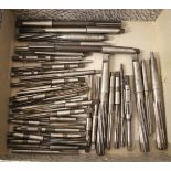 A collection of forty precision reamers.