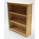 A maple-finish open bookcase fitted two open shelves, 39½” wide x 45½” high.