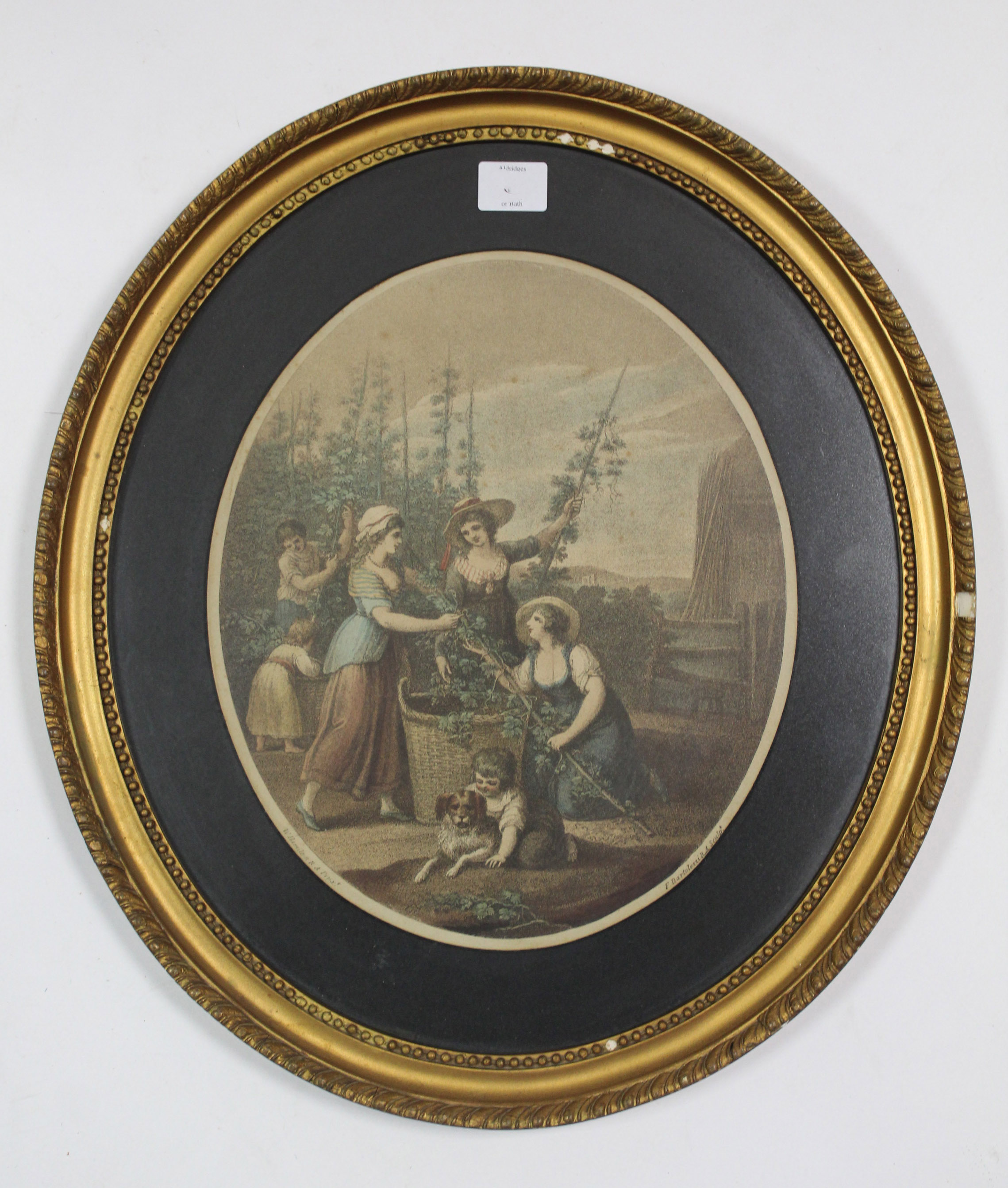 A Bartolozzi oval coloured engraving by W. Hamilton depicting hop pickers, 12¼” x 19¼” in glazed