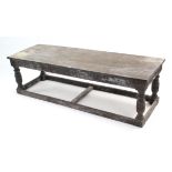 A large hardwood low coffee table with rectangular top, carved frieze, & on bulbous-turned legs with