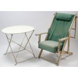 A white painted metal garden table with circular top, & on square fold-away legs, 29” diam.; & a