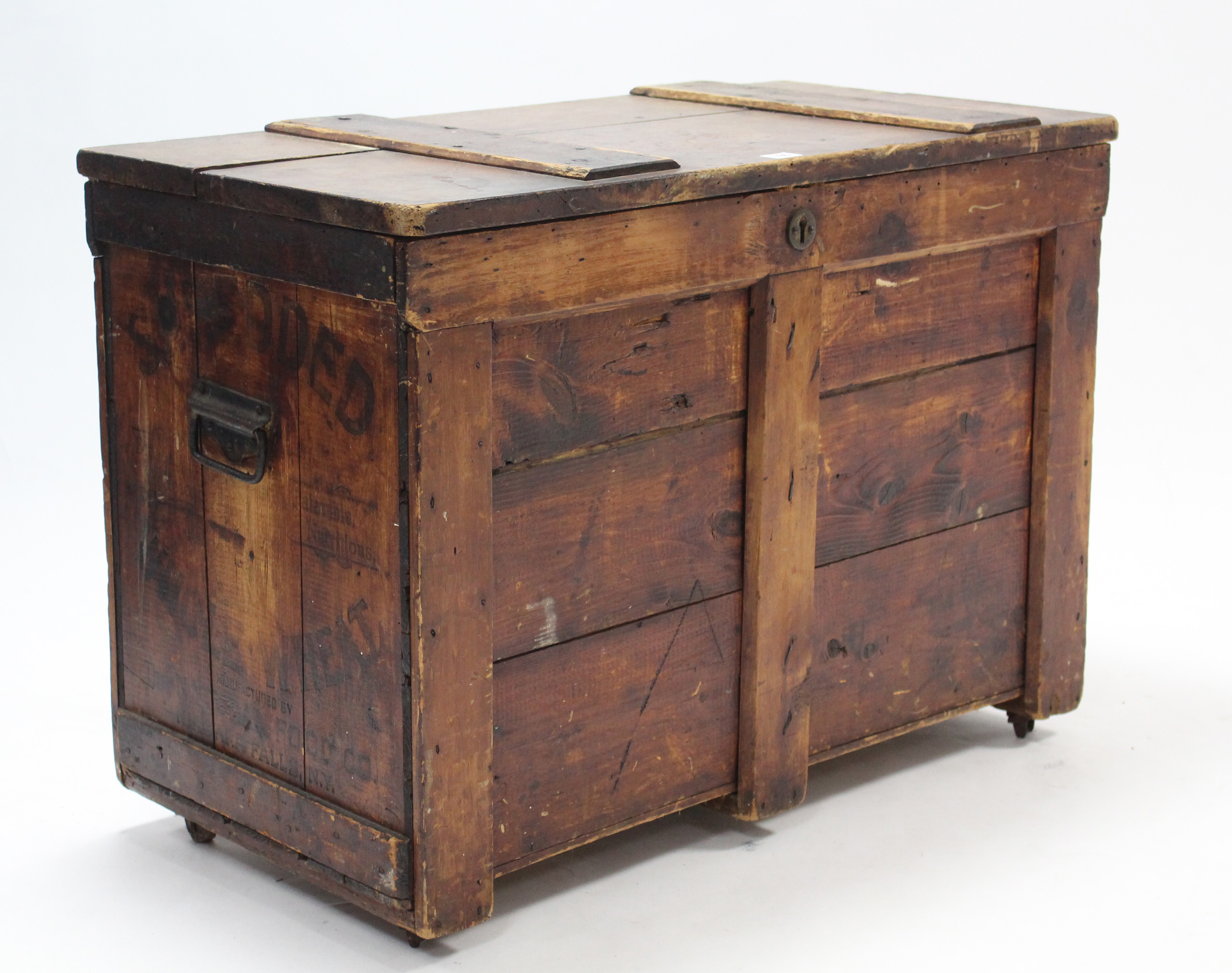 A deal storage trunk with hinged lift-lid, & with wrought-iron side handles, 34¼” wide x 24” high.