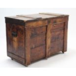 A deal storage trunk with hinged lift-lid, & with wrought-iron side handles, 34¼” wide x 24” high.