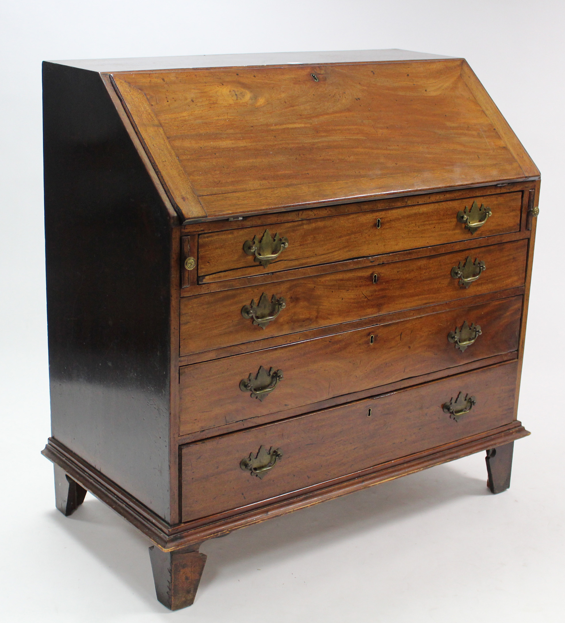 A Georgian mahogany bureau, with fitted interior enclosed by fall-front above four long graduated