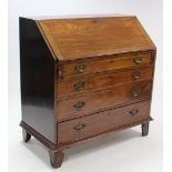 A Georgian mahogany bureau, with fitted interior enclosed by fall-front above four long graduated