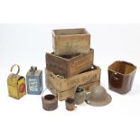 Three wooden advertising crates; a steel safety helmet; a cannon ball; two glue pots; a “Valor”