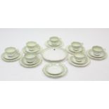 A Court china twenty-four piece part tea service of white ground & with green foliate design.