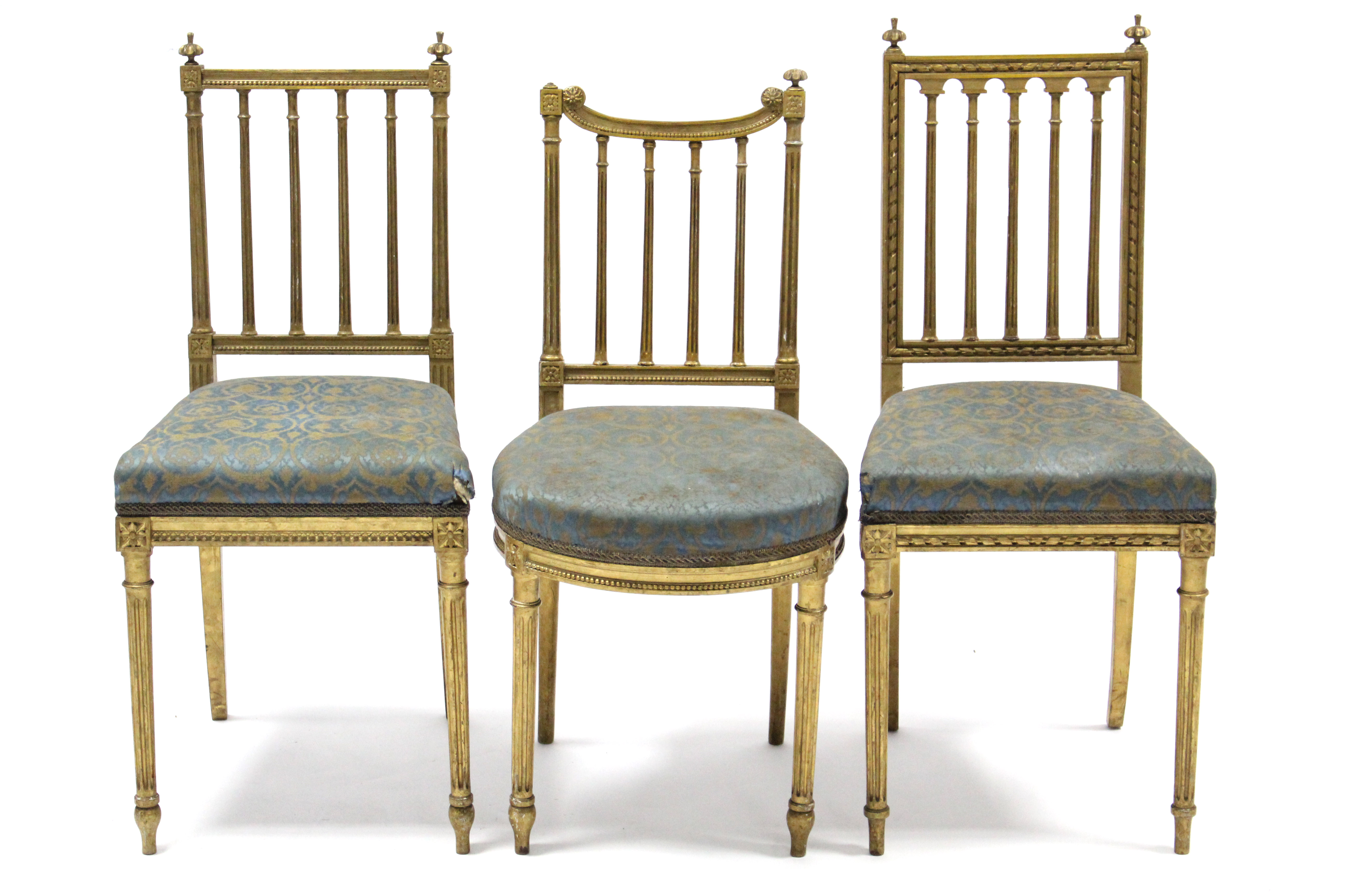 A pair of 19th century gold painted salon chairs with fluted rail-backs, padded seats & on fluted